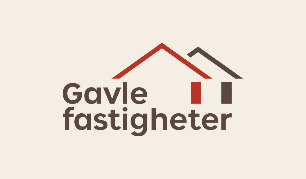 Gavlefastigheters logotyp i röd och varmgrå färg på en ljusbeige bakgrund.